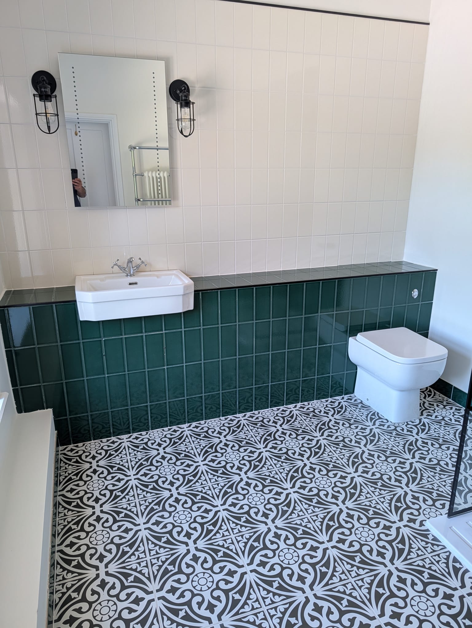 Green wall tiles and Victorian patterned floor bathroom renovation Leicester
